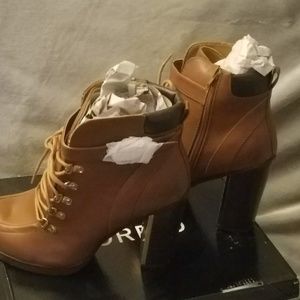 Never before worn Torrid tie up shoe boots